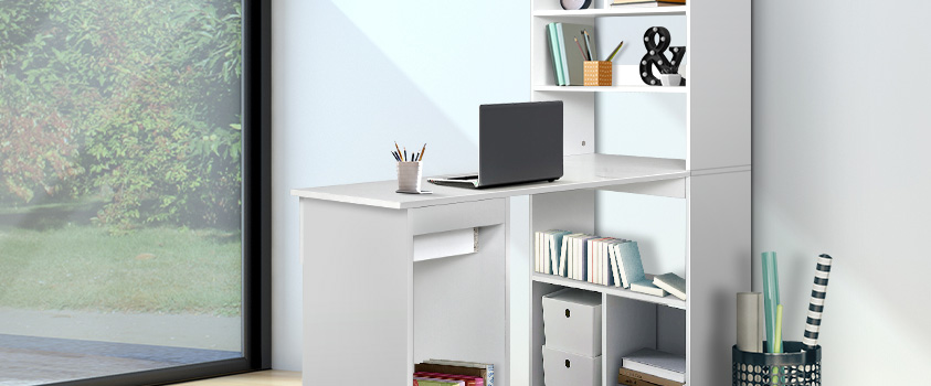 An Artiss White Office Computer Desk, set against a white wall by an open bay window.