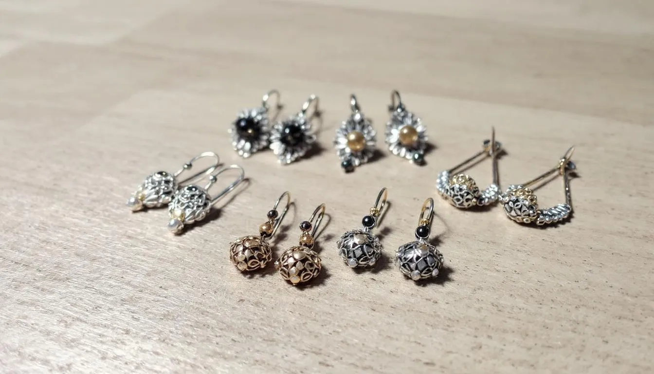 This image showcases a stunning pair of handmade earrings, featuring unique sterling silver designs that dangle gracefully. The elegant craftsmanship and sparkling accents make them a perfect addition to any jewellery collection, ideal for both special occasions and everyday looks.