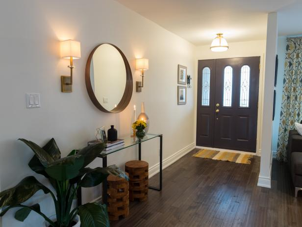 Cozy entry space with wall sconces