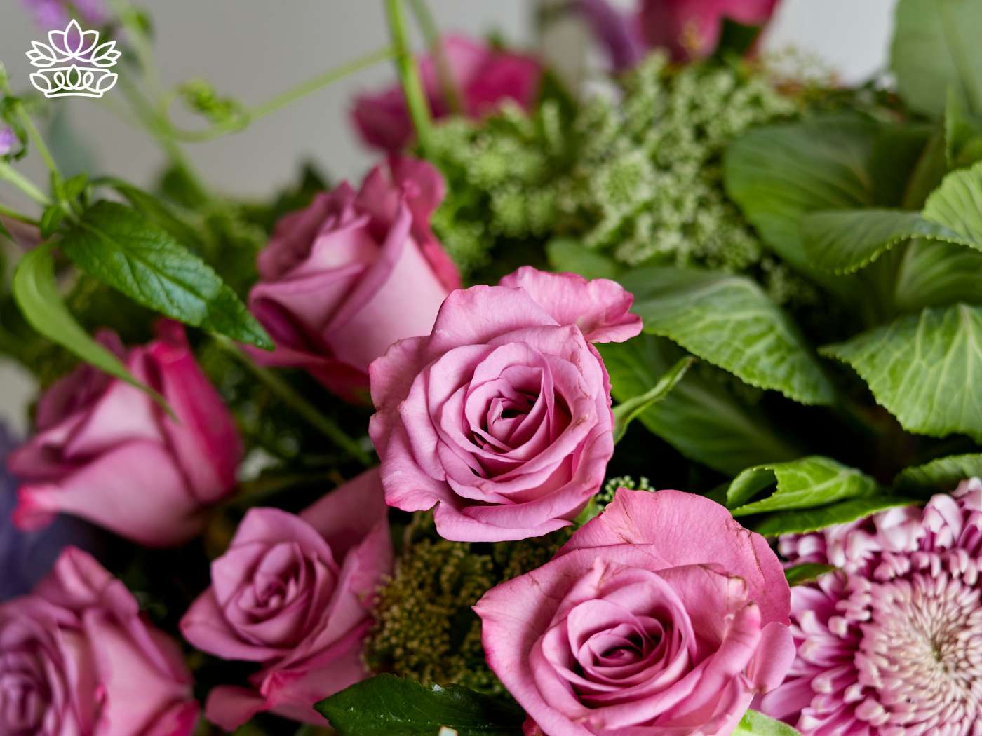 Close-up of exquisite pink roses with lush green foliage, part of the elegant Congratulations Flower and Gift Collection—Fabulous Flowers and Gifts.