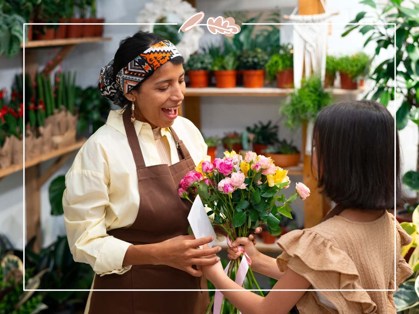 Daughter hands mum a fresh mixed bouquet with envelope; joyful reaction in plant-filled shop — Fabulous Birthday Wishes for Mom.