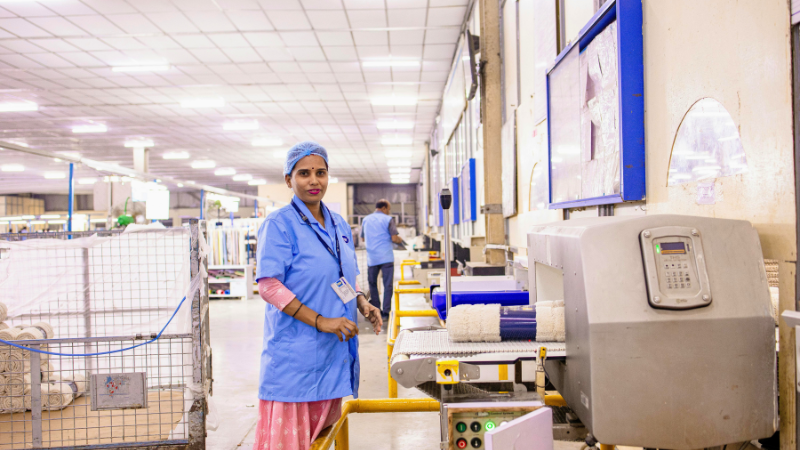 An individual working in an assembly line in a factory