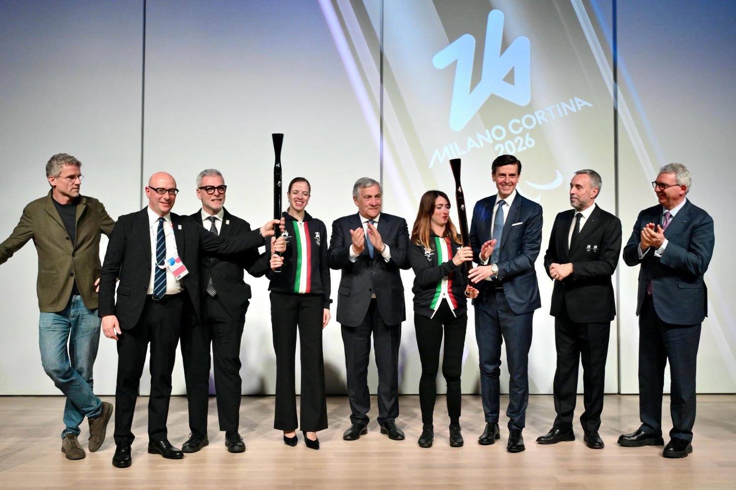 The Minister of Foreign Affairs and International Cooperation Antonio Tajani, the CEO of the Milano Cortina 2026 Foundation Andrea Varnier, Mario Vattani, Commissioner General for Italy at Expo 2025 Osaka, the CEO of Versalis Adriano Alfani, Torch designer Carlo Ratti from CRA-Carlo Ratti Associati studio.