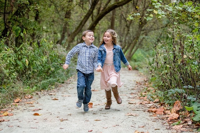 Siblings holding hands