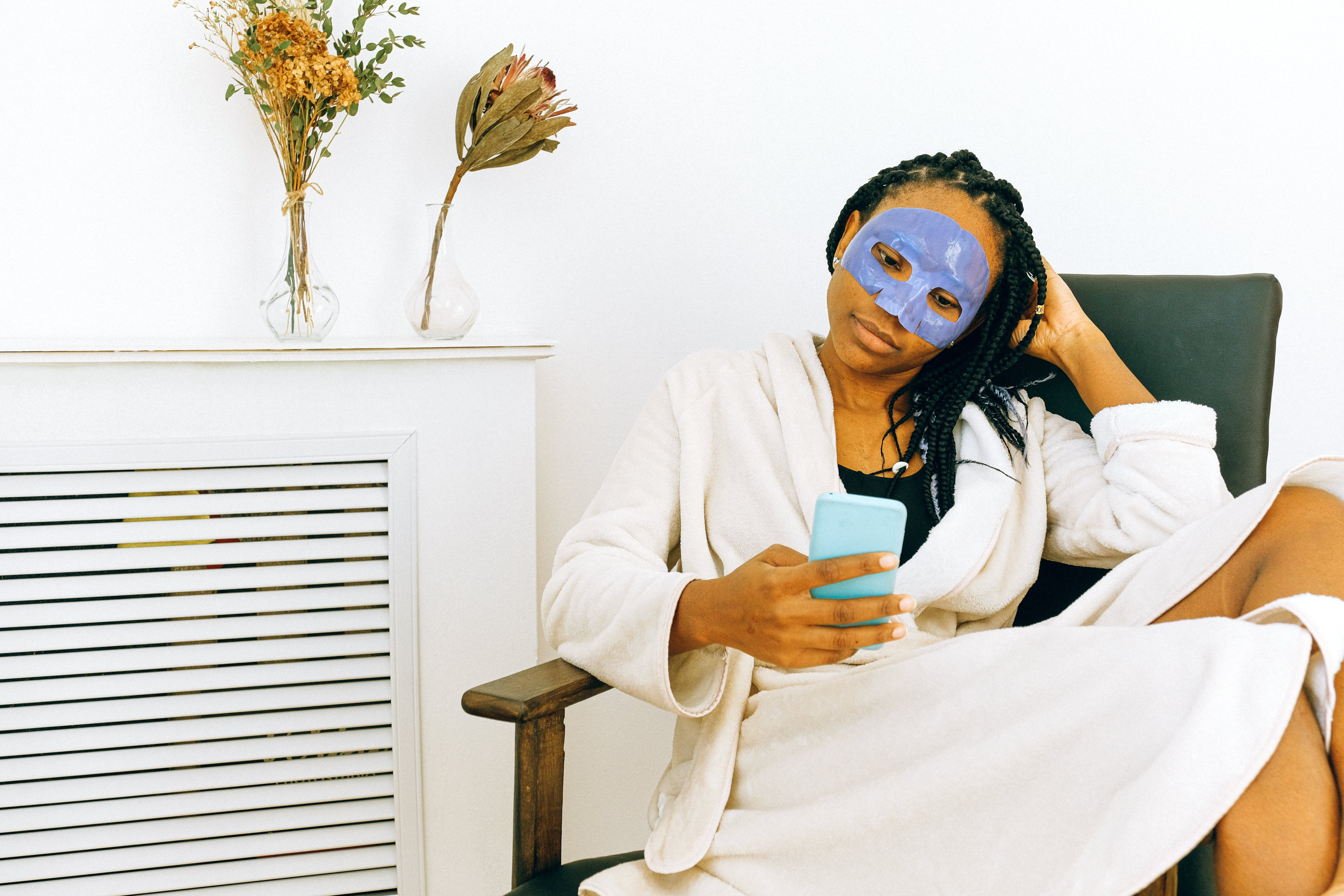 person using a face mask as a part of her bedtime routine 