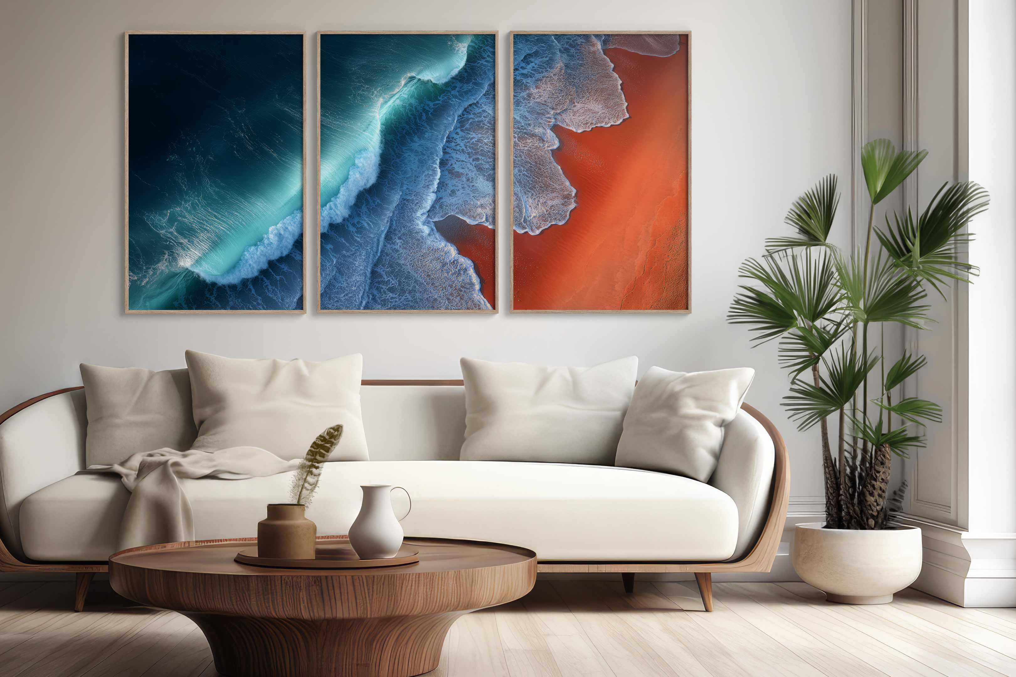 A bright living room features a large nature-inspired fine art print above a linen sofa, with soft natural light streaming through the windows, creating an inviting atmosphere. This curated collection of art captures quiet landscapes, evoking a sense of faraway travels and inspiration.
