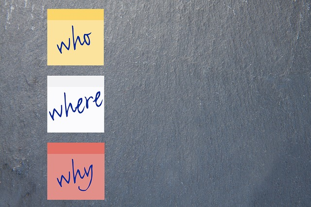 Three sticky notes that read "who" "where" and "why"