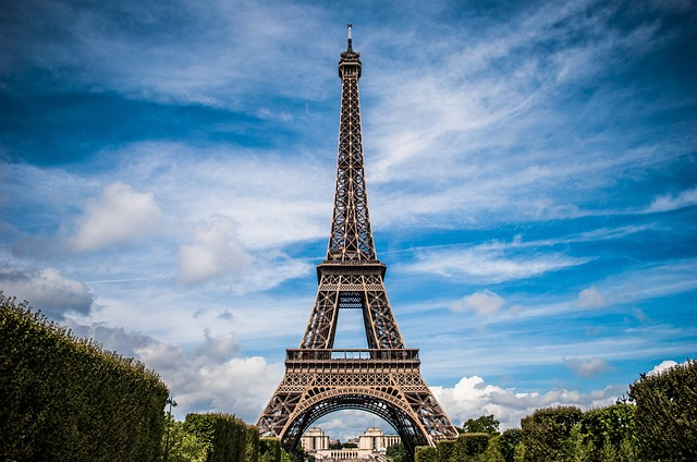 Eiffel tower in blue sky 
top 20 happiest travel destinations in the world
