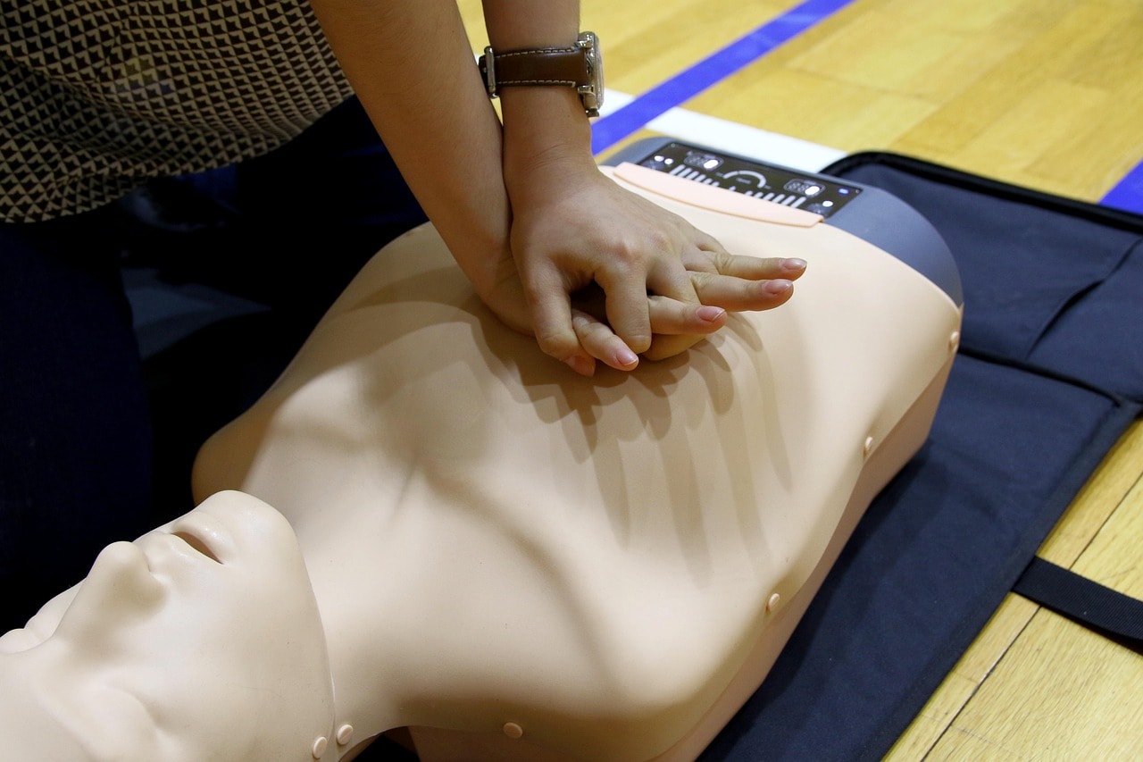 Demonstration of hands-only CPR technique.