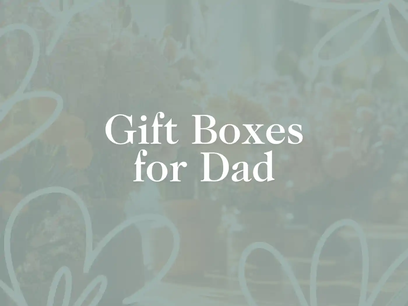 Text 'Gift Boxes for Dad' over a blurred floral background, representing thoughtful presents for fathers. Fabulous Flowers and Gifts.