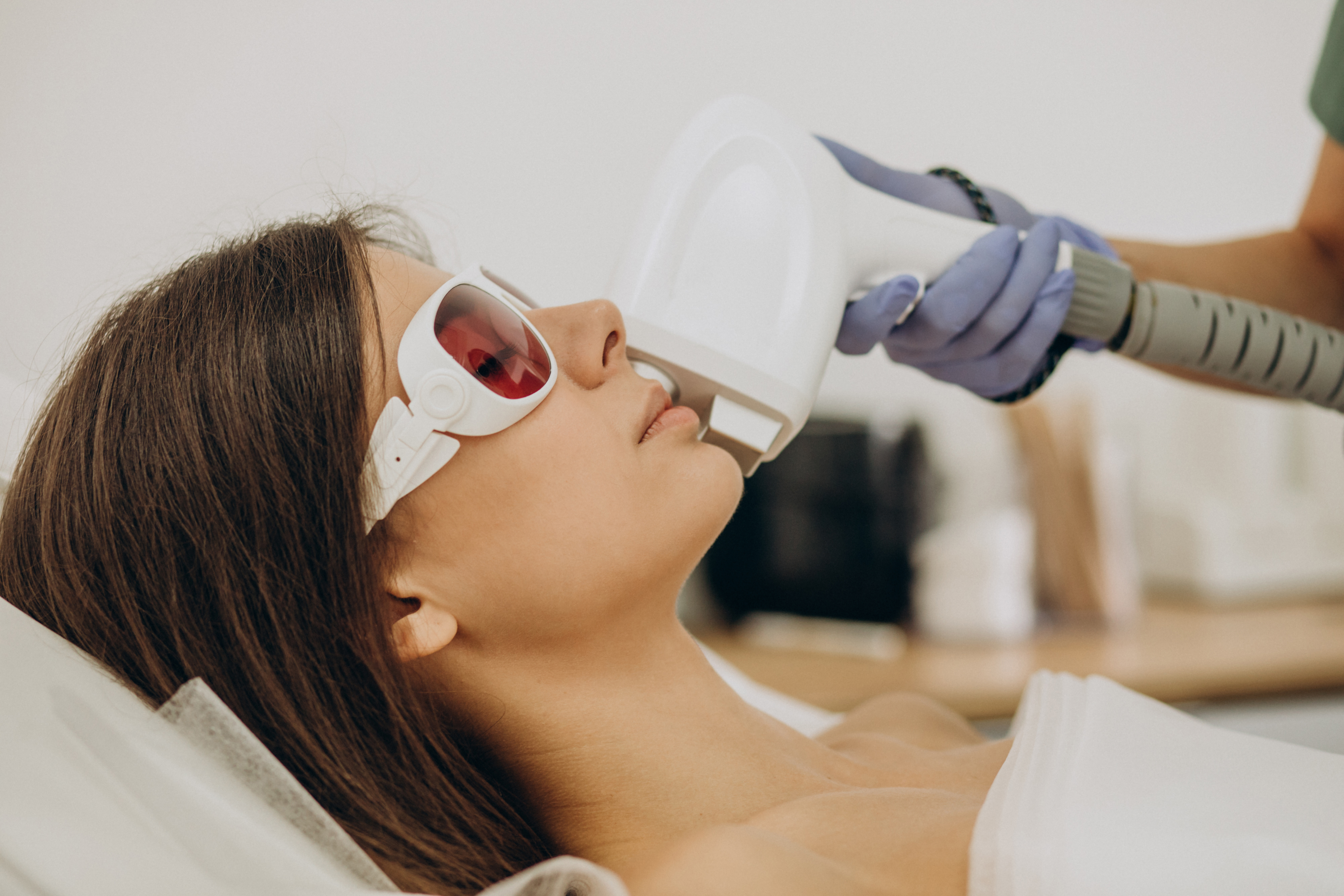                                            Woman undergoing a session of laser hair removal.