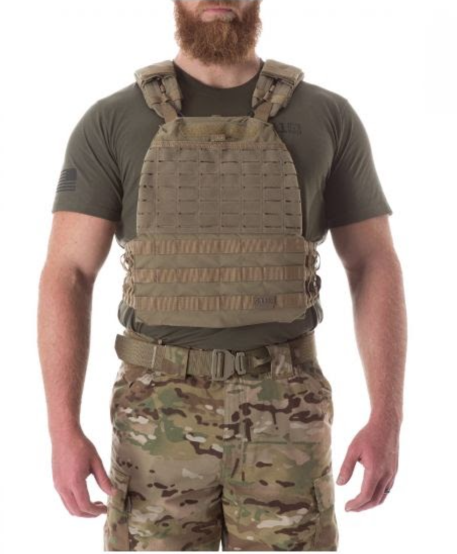 Plate carrier worn by bearded man in fatigues