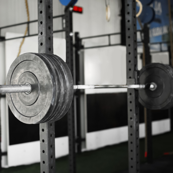 An image of a power rack with safety bars in place on a squat rack.