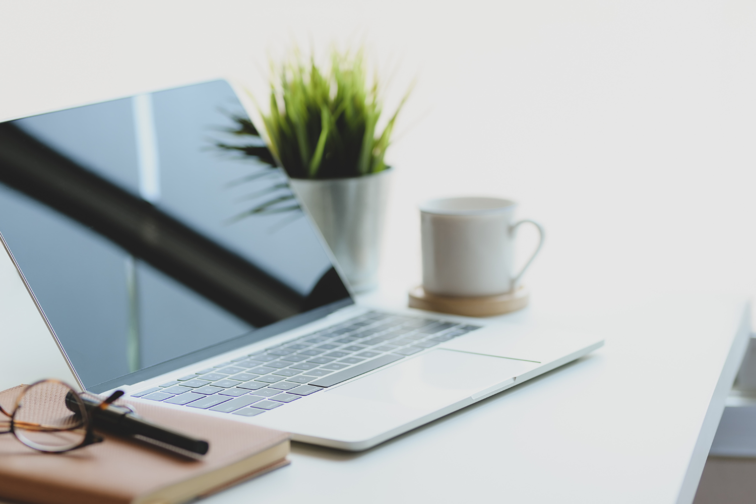 A laptop on a desk.