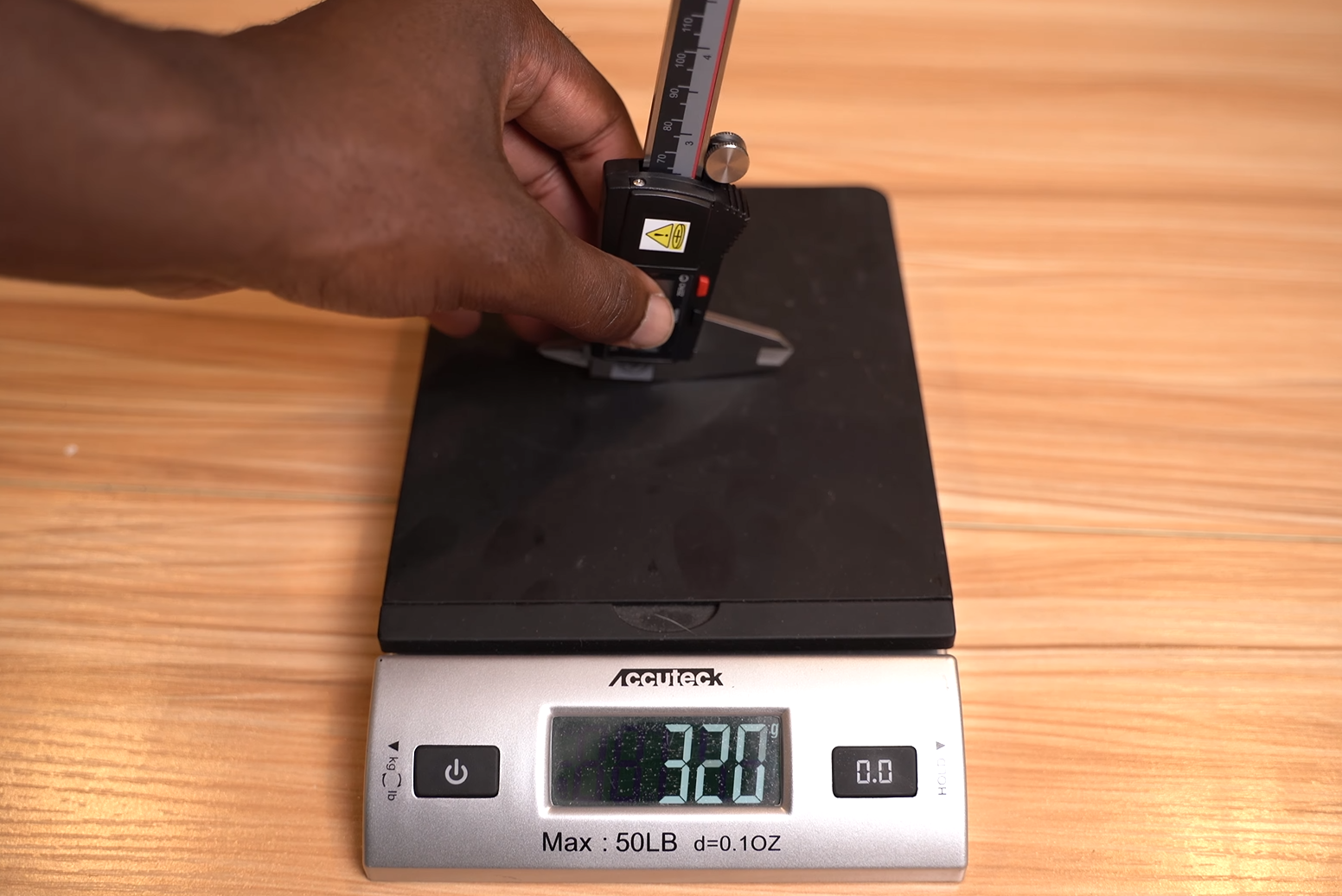 sliding a Starrett digital caliper to test smoothness