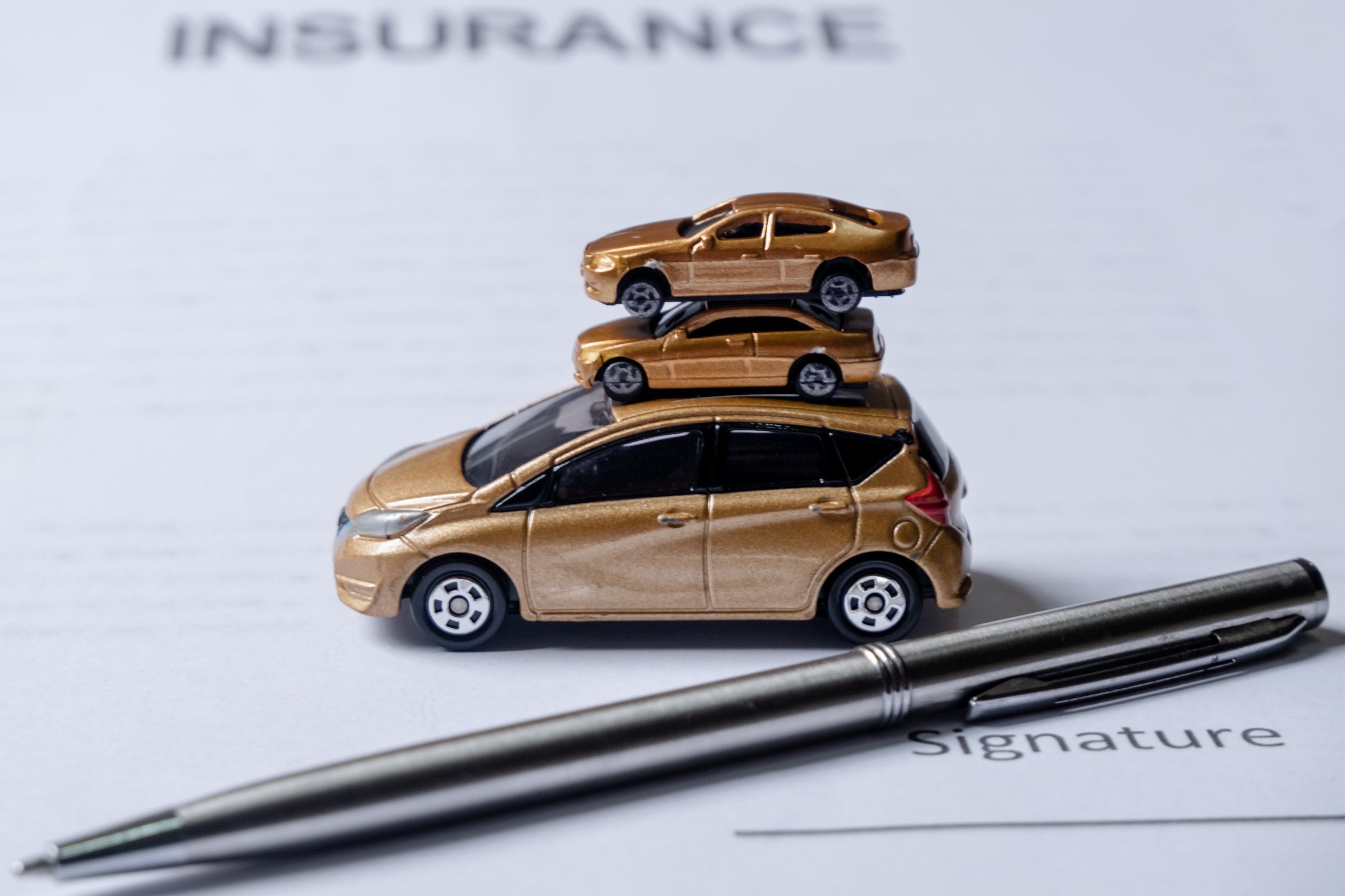 Image of cars and a insurance document