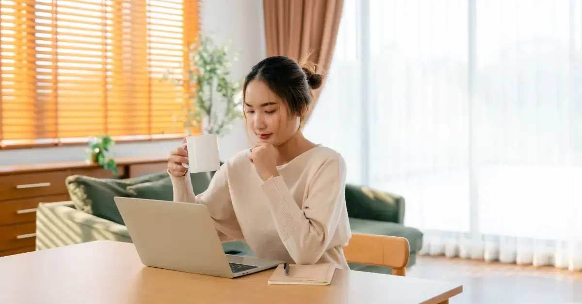 Woman reviewing currently not collectible status foreign taxpayer records abroad.
