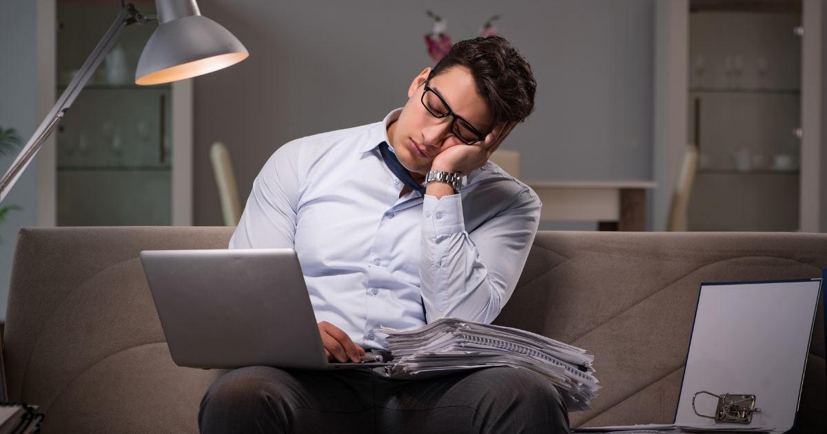 Man falling asleep while working