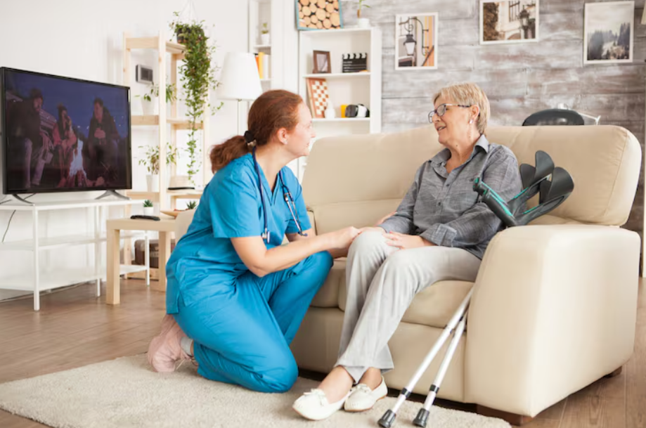 A caregiver talking to an elderly