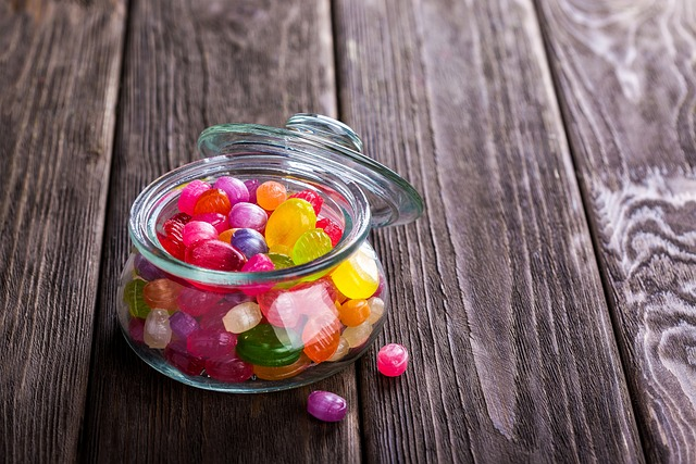 An image of a jar of various hard candies.