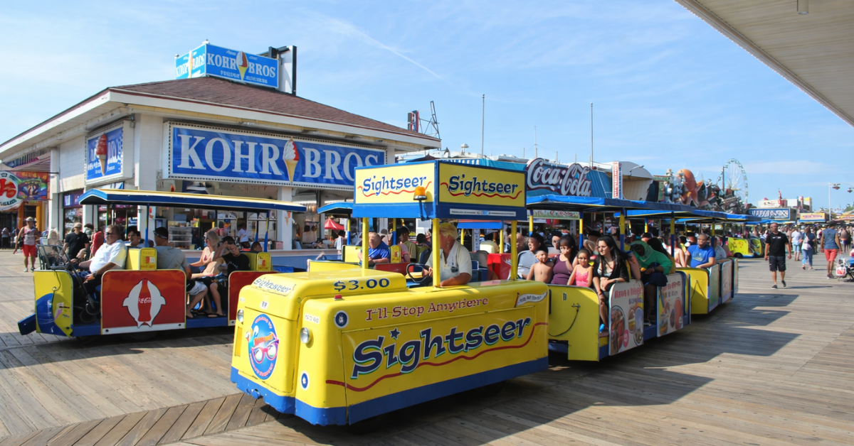 Sightseer tram ride on the Wildwood Boardwalk passing Kohr Bros frozen custard stand along the famous Jersey Shore boardwalk attractions.