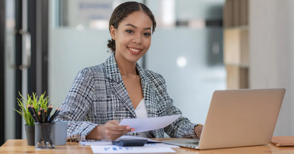 Can an LLC write off a car purchase? A woman managing her LLC's tax deductions while reviewing vehicle expenses for her OnlyFans business.