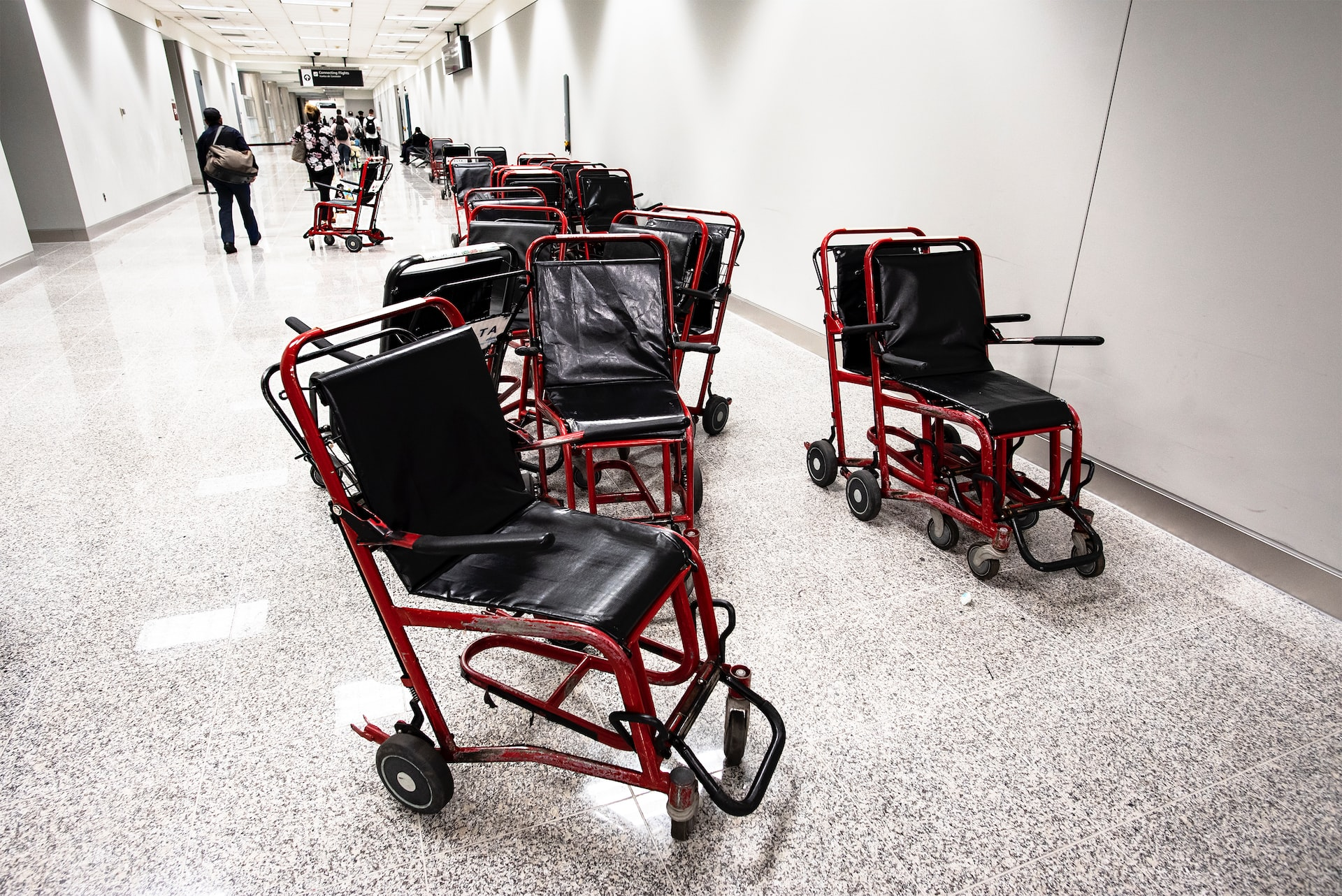 Wheelchairs in an airport hallway.
