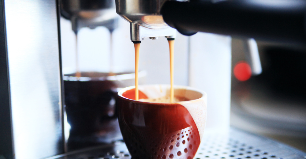 espresso flowing on a cup 