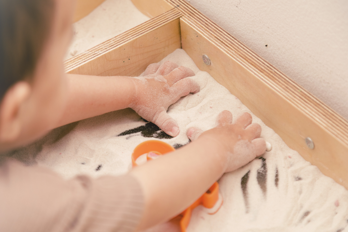 Child playing with a sandbox