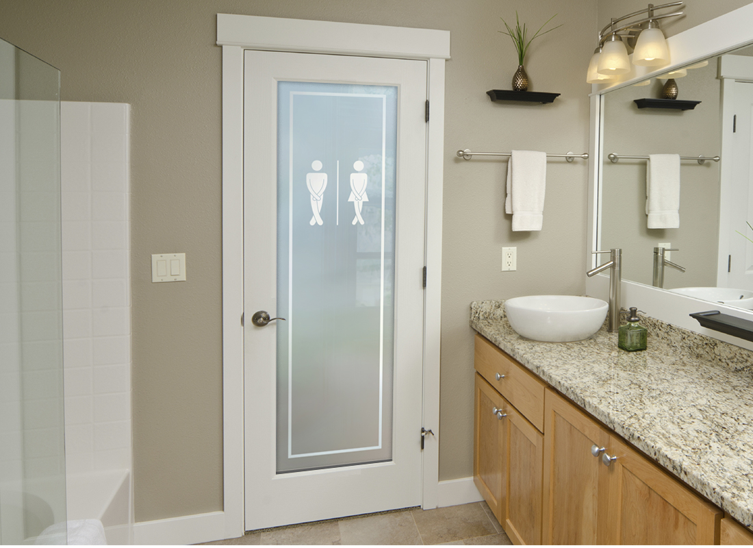 A bathroom with a frosted glass door providing complete privacy.