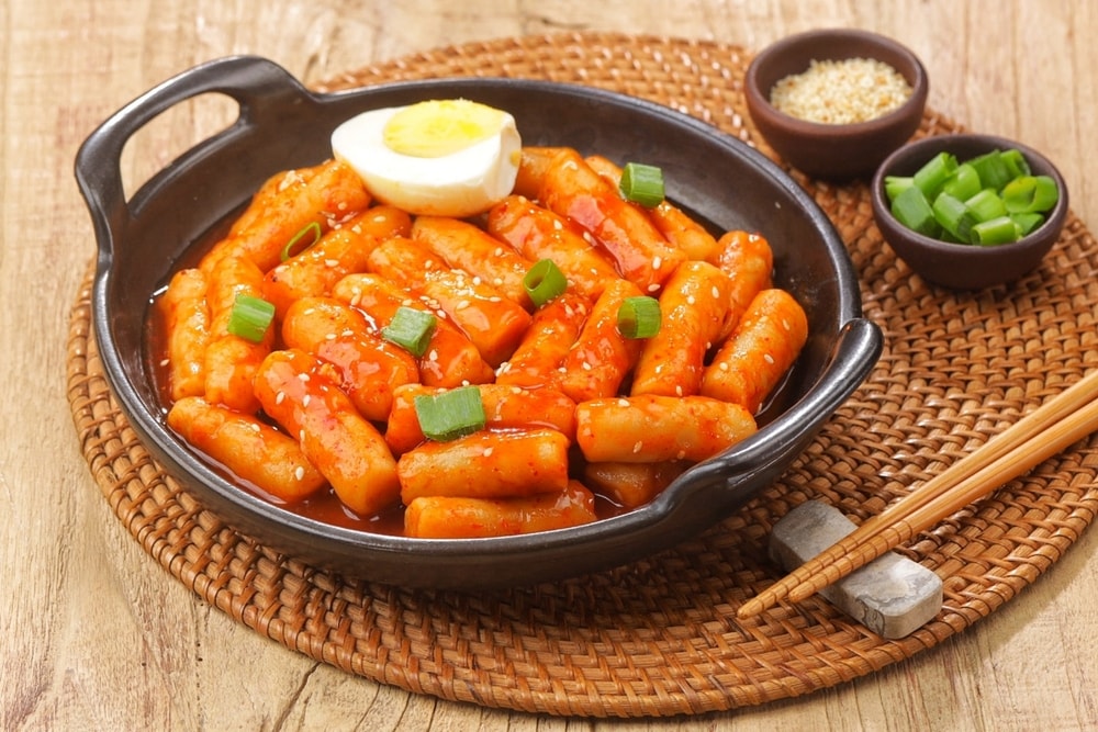 Tteokbokki is a Korean dish of rice flour cooked in spicy and sweet gochujang seasoning
