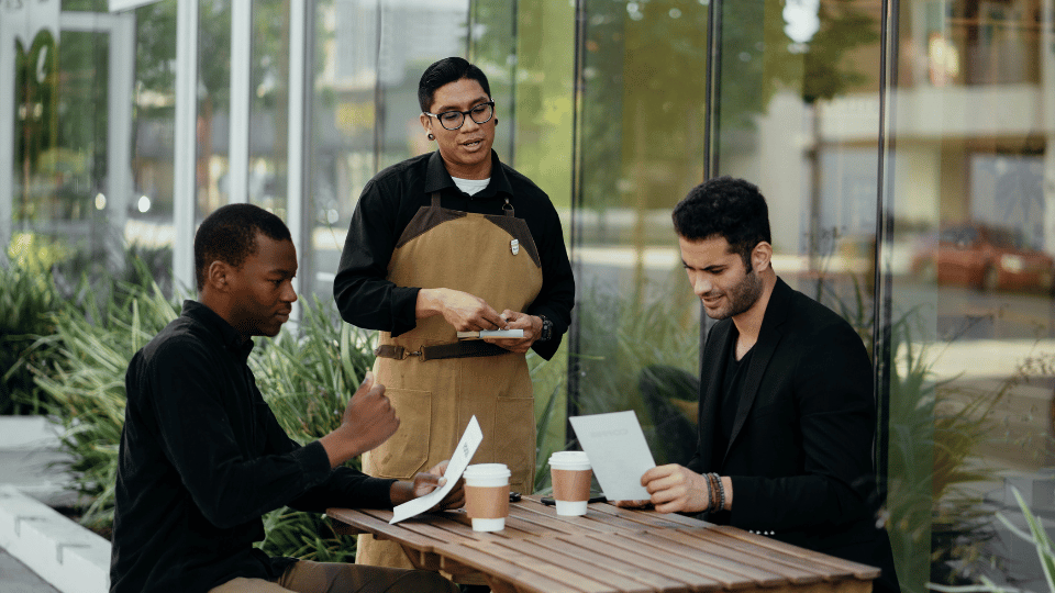 Waiter taking orders