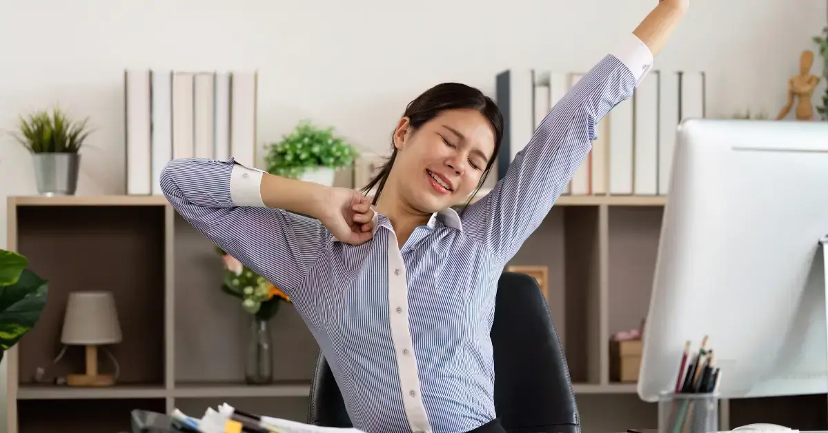 Woman organizing tax forms after understanding FICA contribution limit.