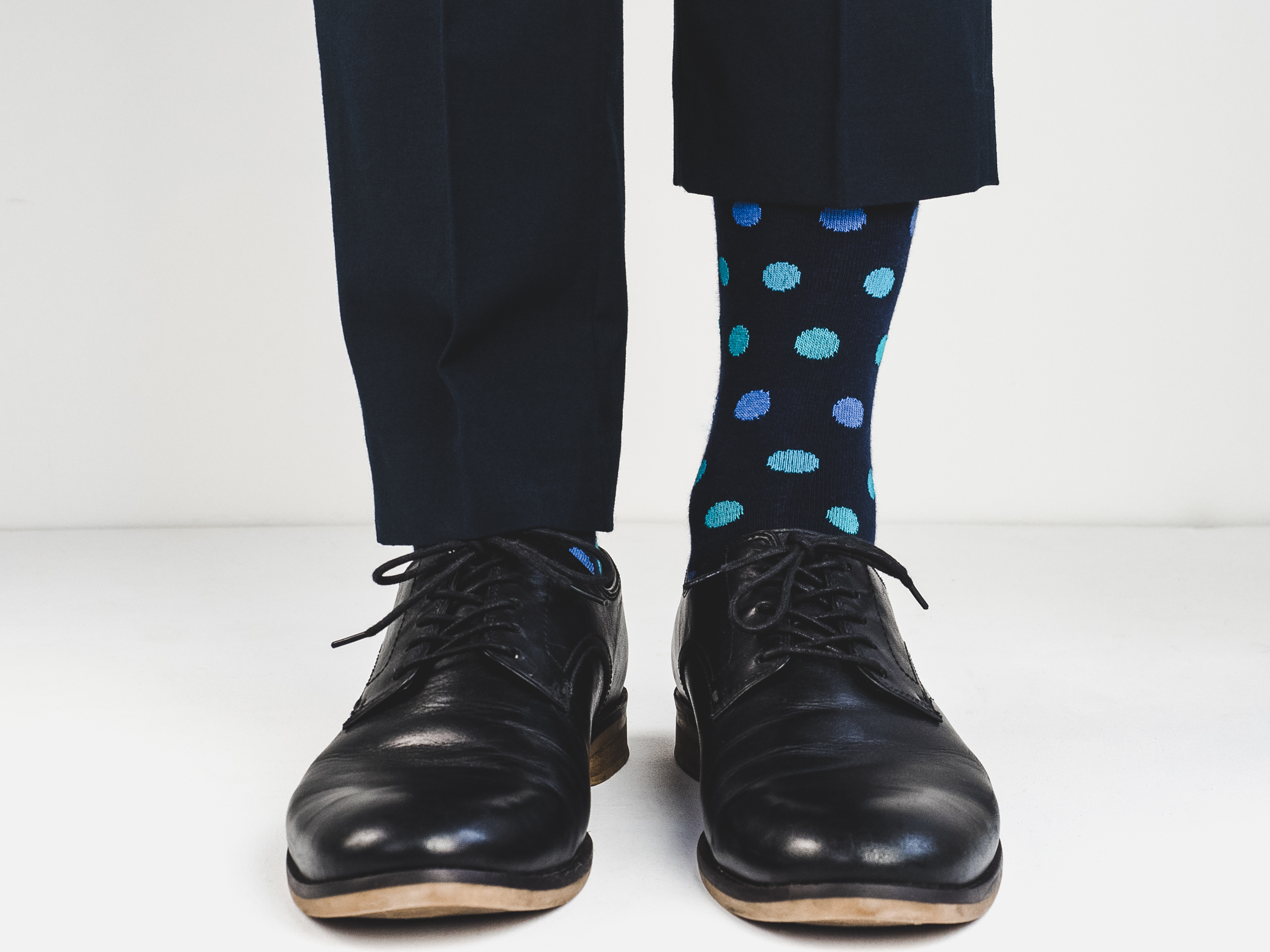 Colorful dot pattern socks with black shoes