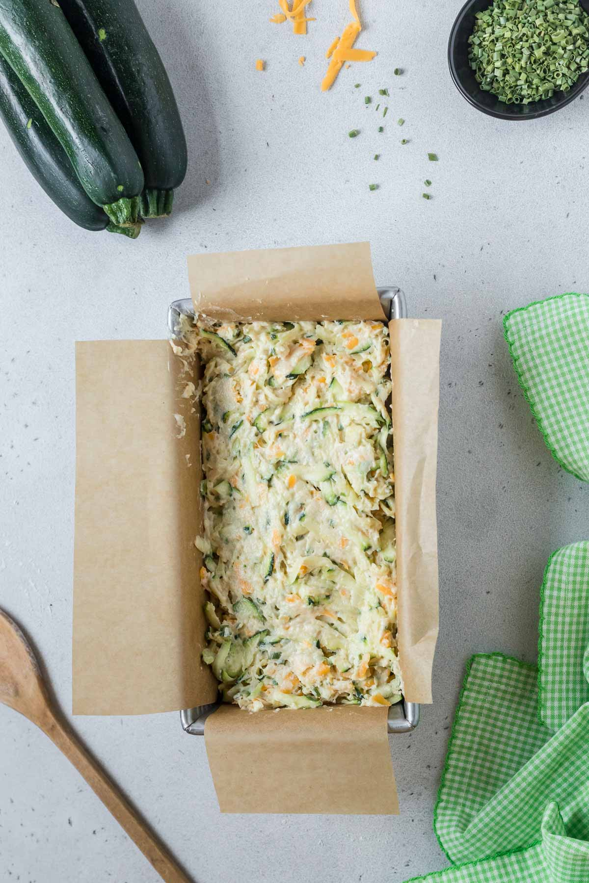 unbaked zucchini cheddar bread in loaf pan
