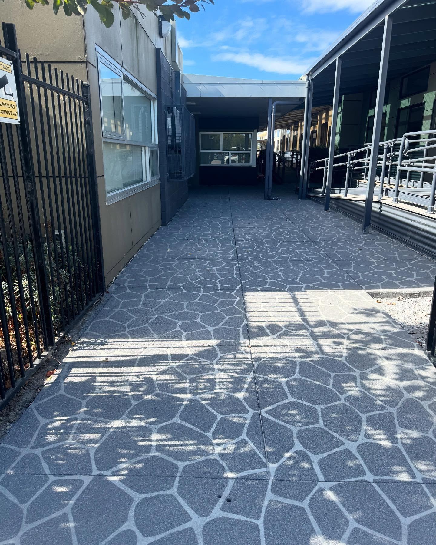 Concrete resurfacing in Pakenham school featuring a durable, slip-resistant decorative finish designed for high foot traffic areas.