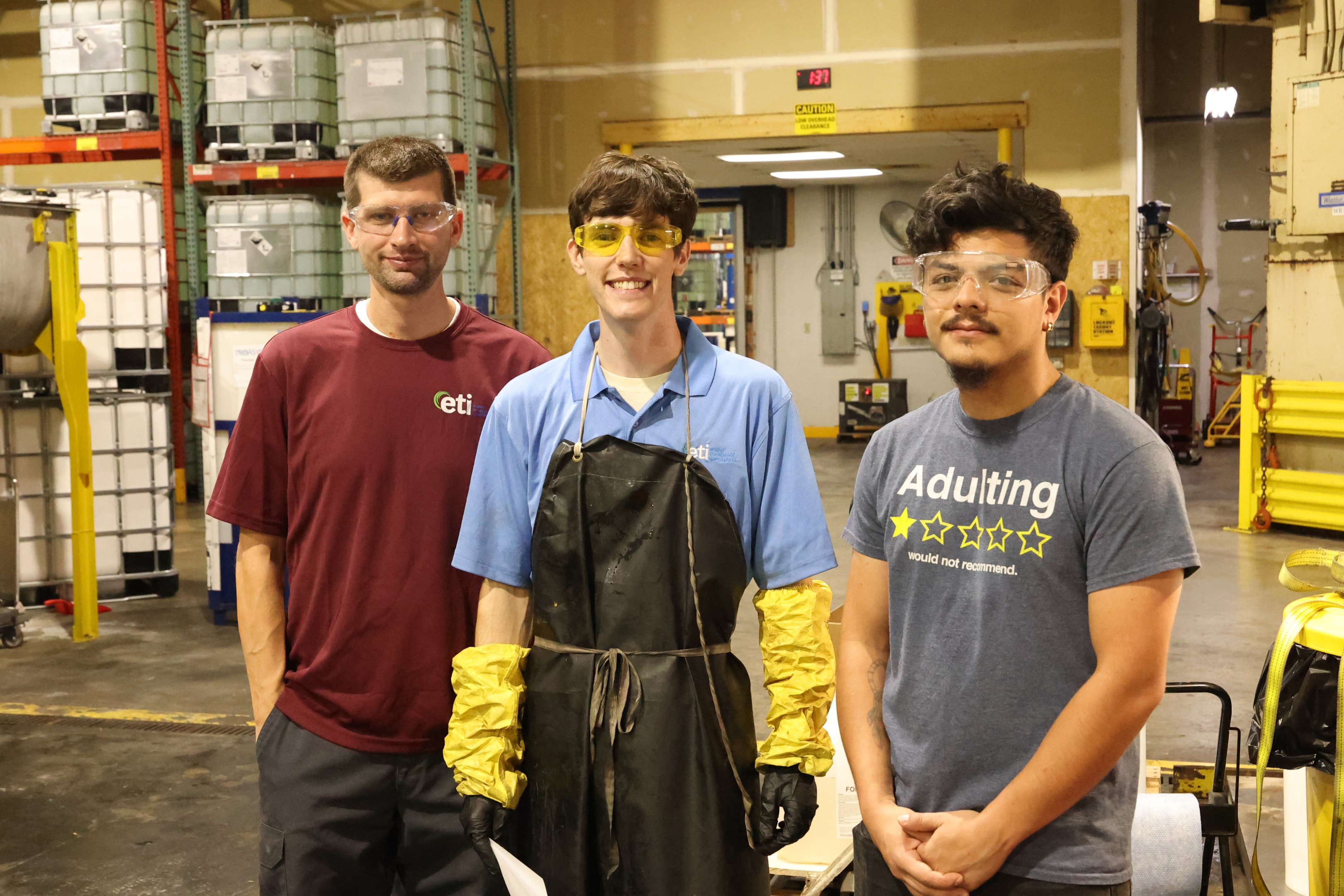 Chemical storage area with bulk chemical containers organized on industrial warehouse racking following safe storage best practices