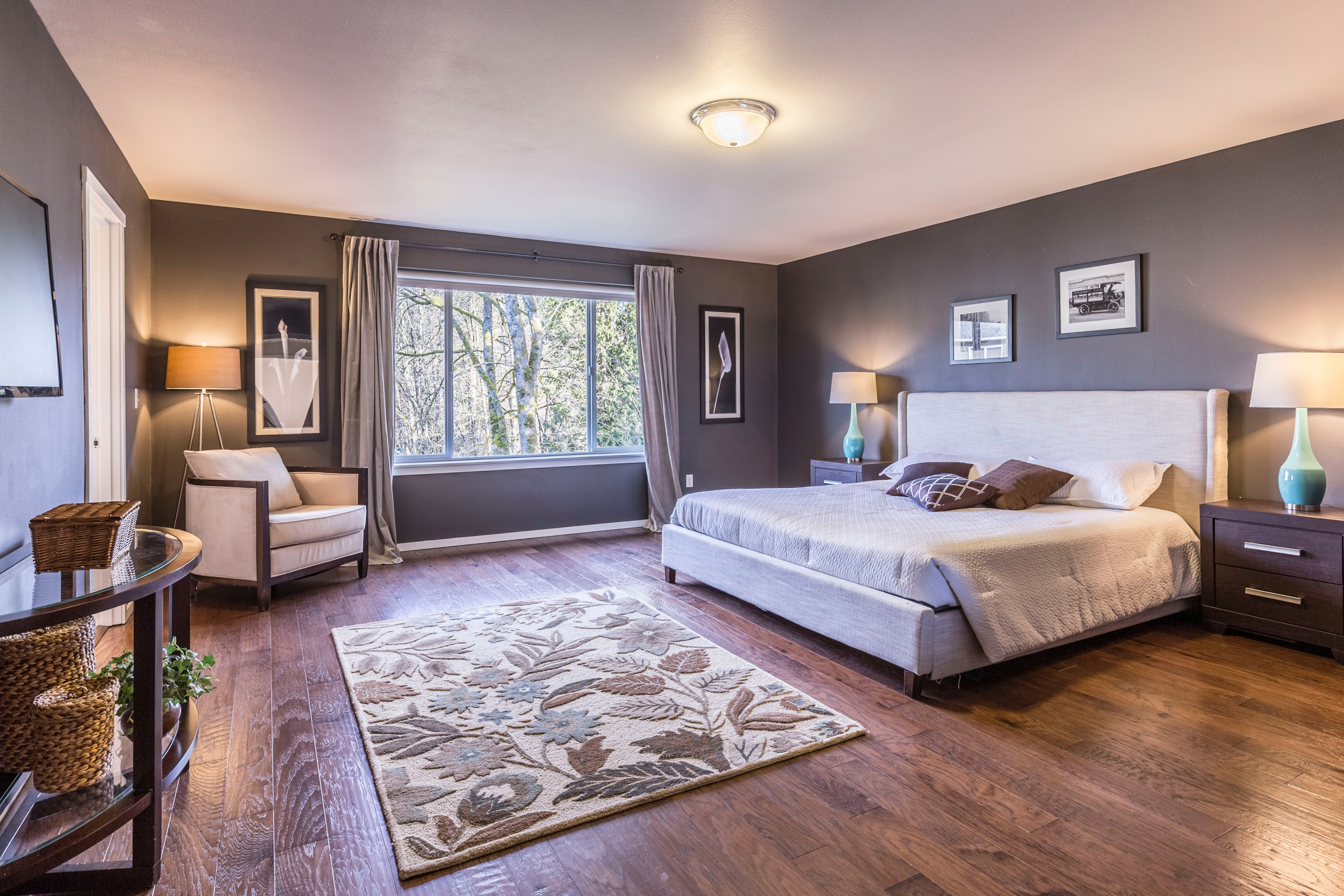 A spacious master bedroom with neutral decor