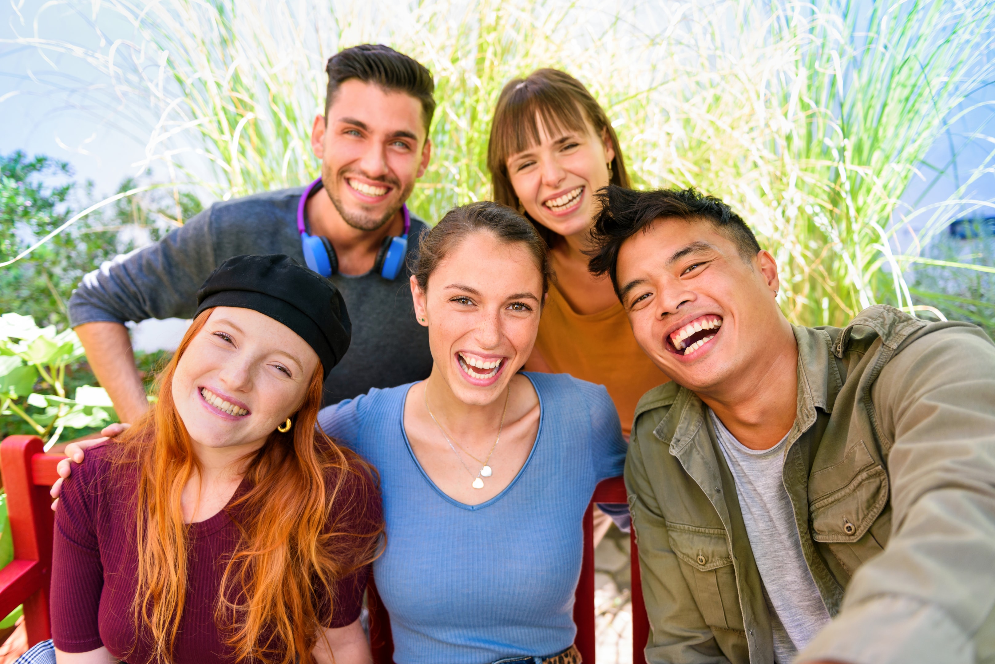 Group of adults smiling after wisom teeth extract