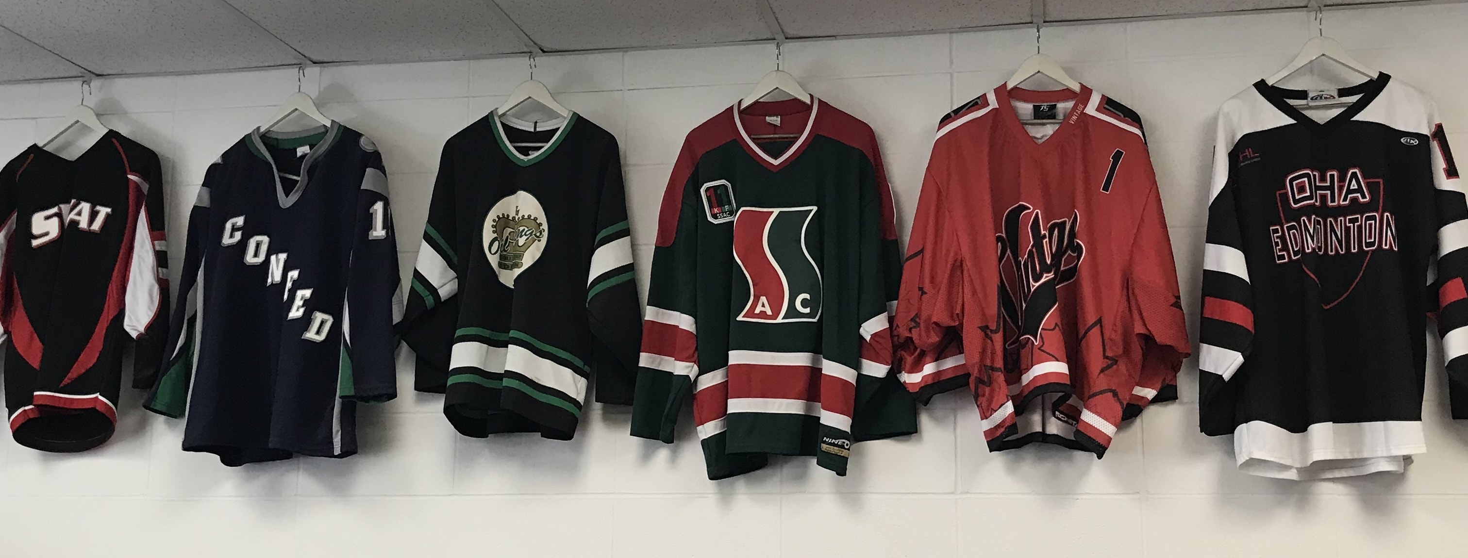 Hockey Jerseys from local teams hung in store. Convience, Trust, and Personal service