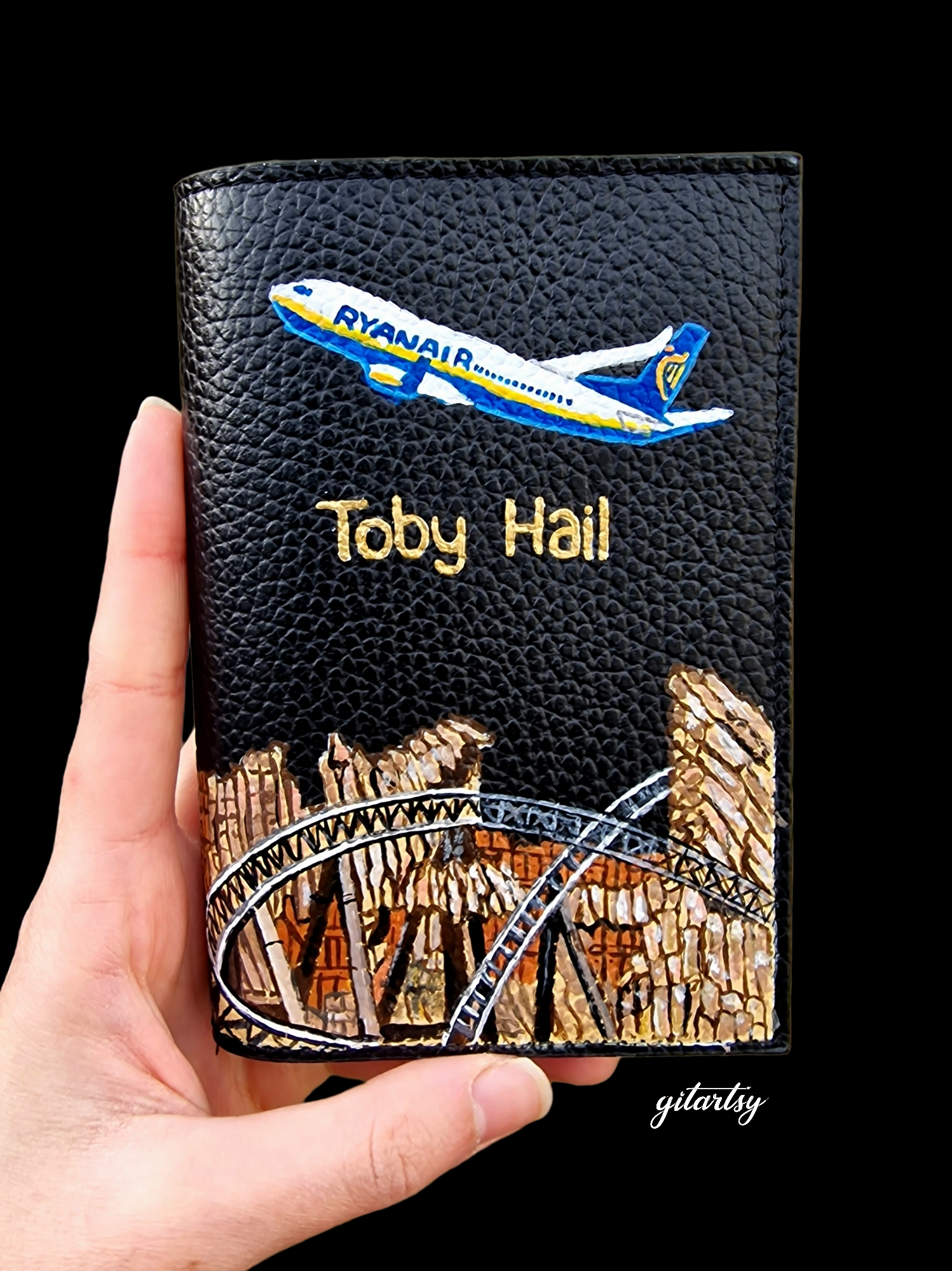 Personalised leather wallet for "Toby Hail" with aeroplane and rollercoaster 