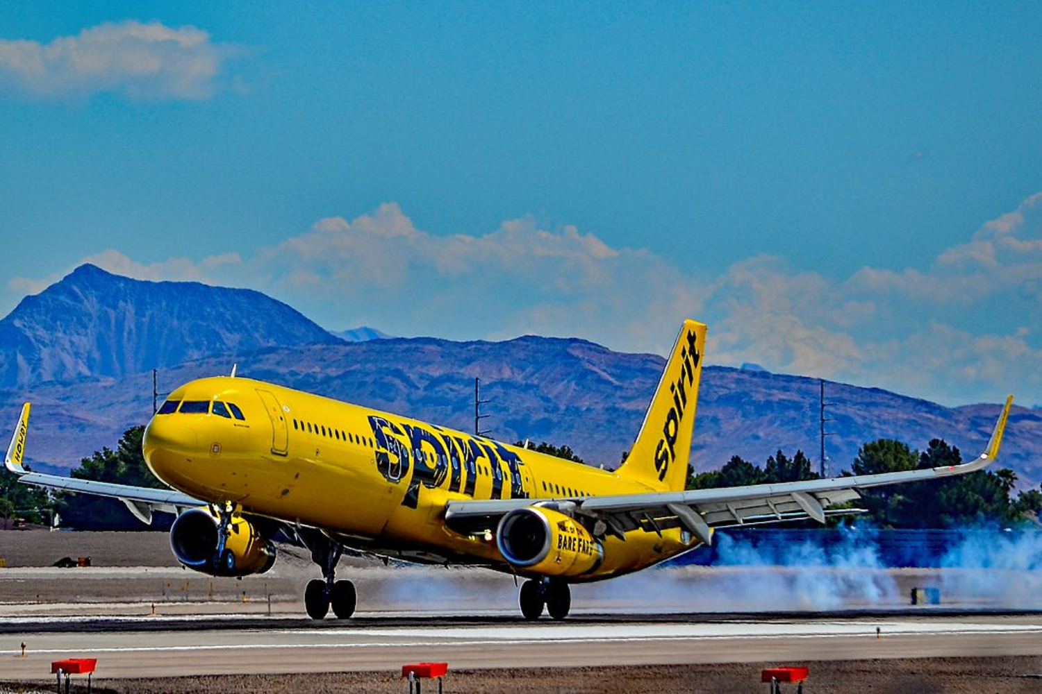 a yellow spirit airlines flight