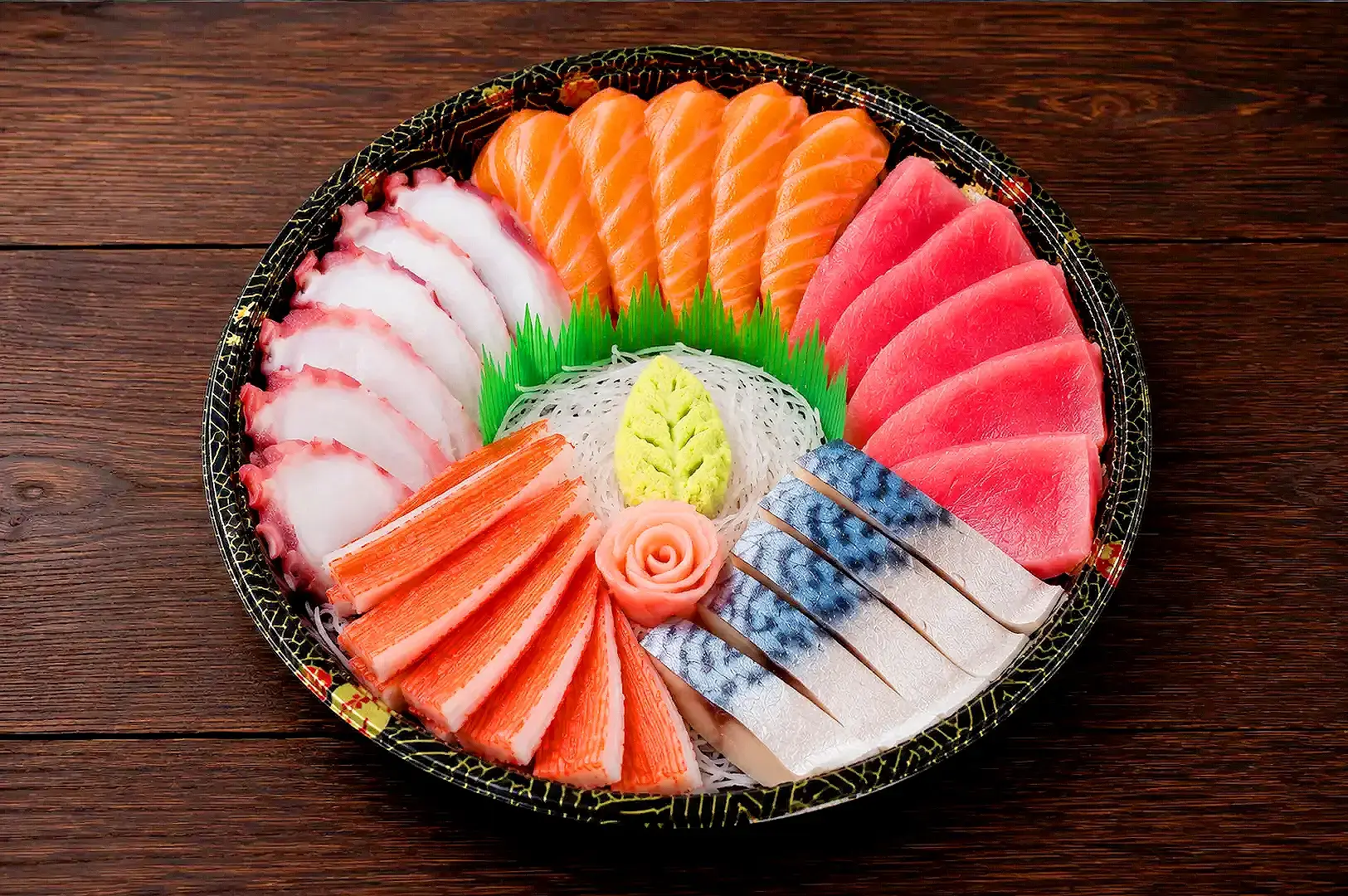 Fresh sashimi platter in Singapore featuring salmon, tuna, octopus, mackerel and crab sticks