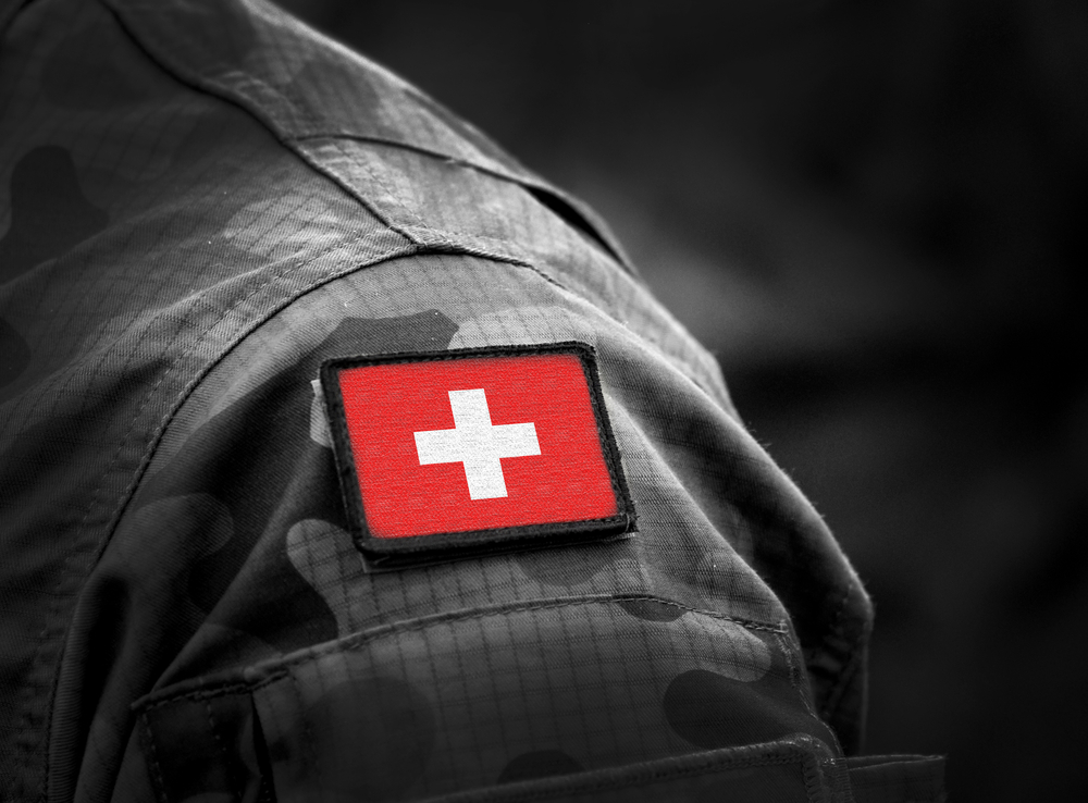 Swiss flag on army uniform.