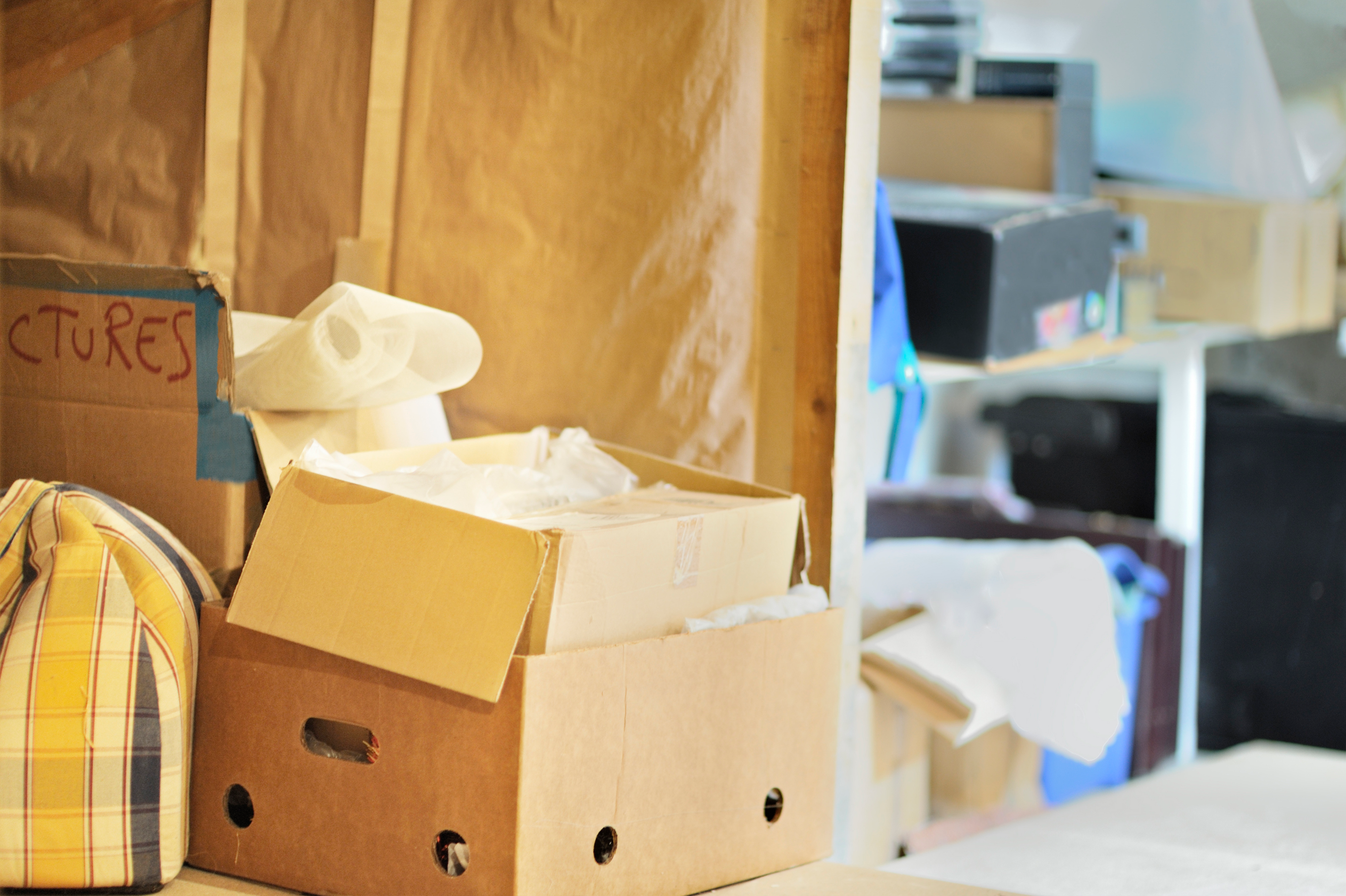 Storage filled with boxes and bags that need to be reorganized