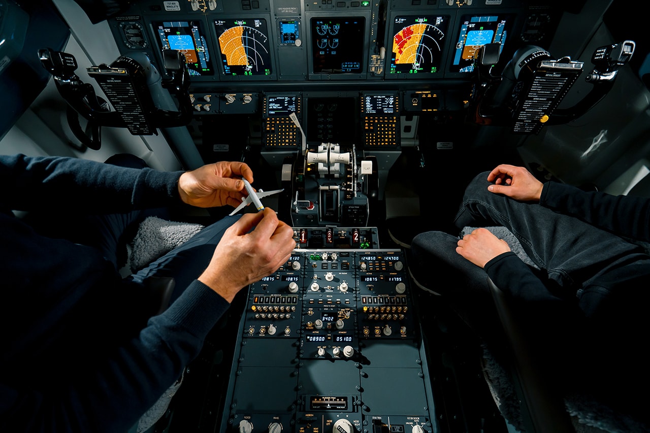 A flight instructor demonstrating flight training with a student pilot.