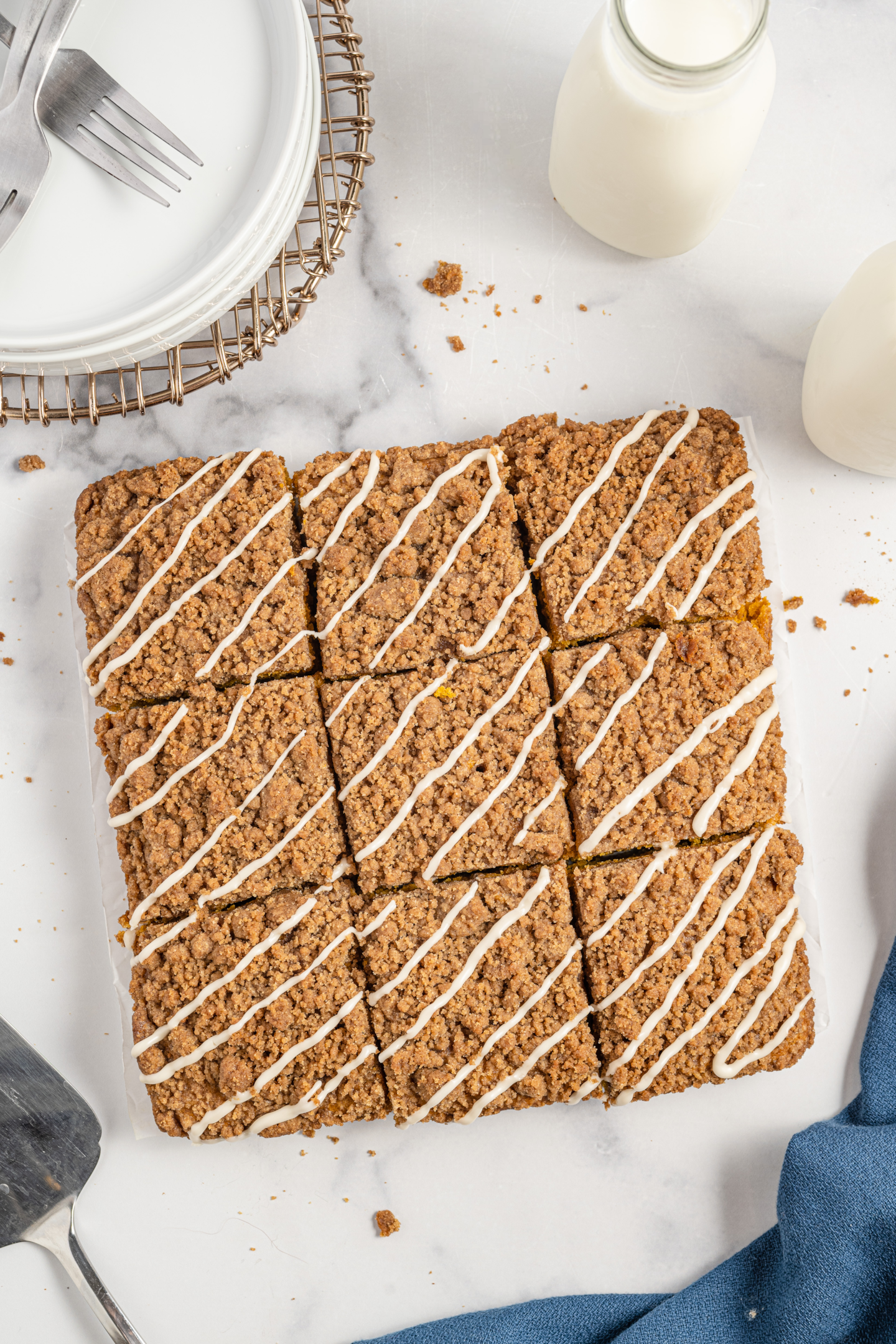 baked pumpkin streusel coffee cake cut into squares