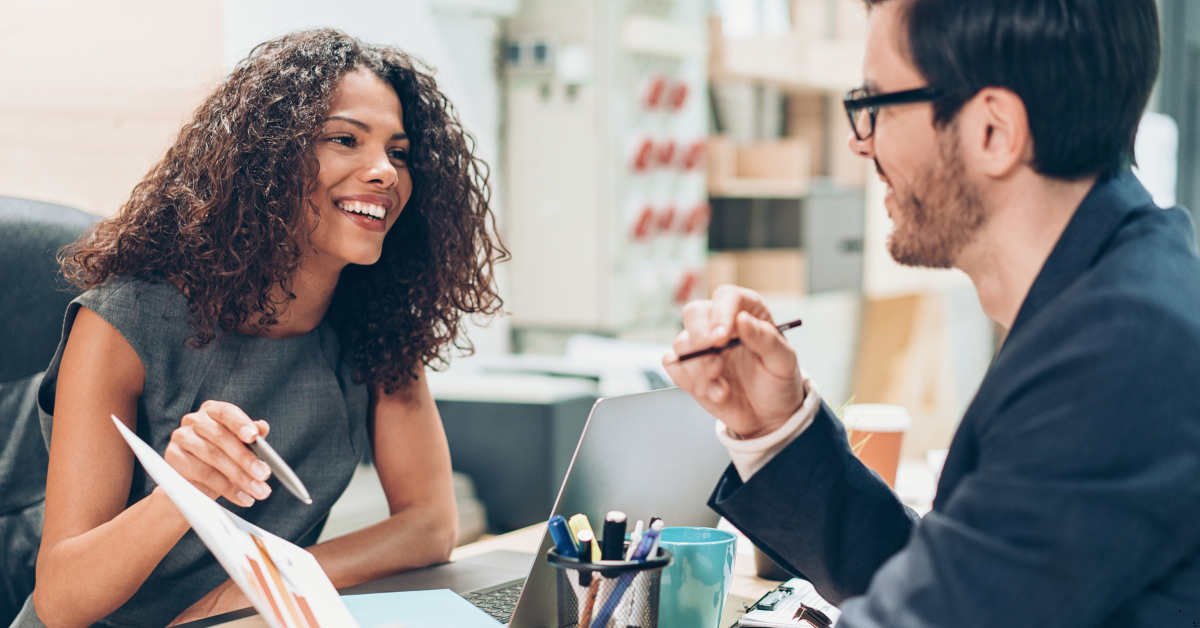 land and house packages - Image of two professionals discussing on a topic