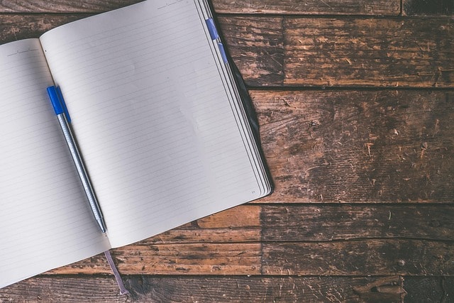 An open journal and pen.