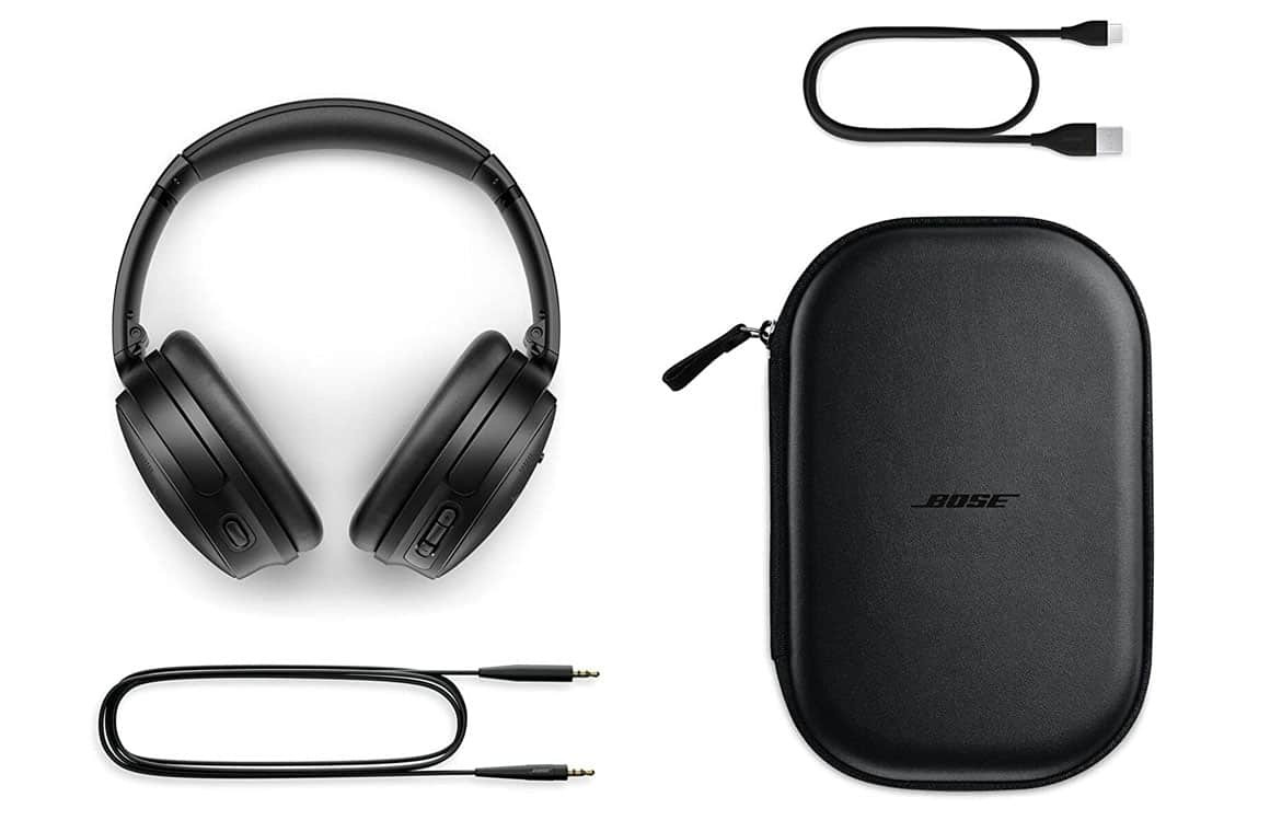 Photo of Bose QuietComfort 45 noise-canceling headphones, featuring a sleek black design with soft ear cushions and adjustable headband, with closed case and connection leads